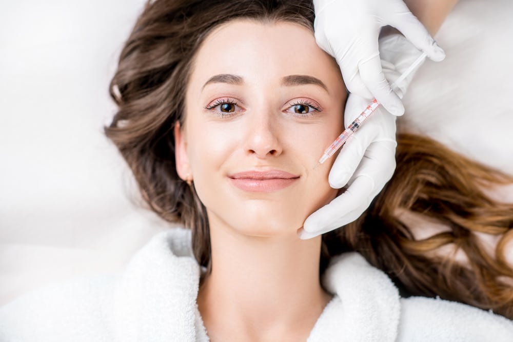 Cassandra Rommel administering Radiesse dermal filler.