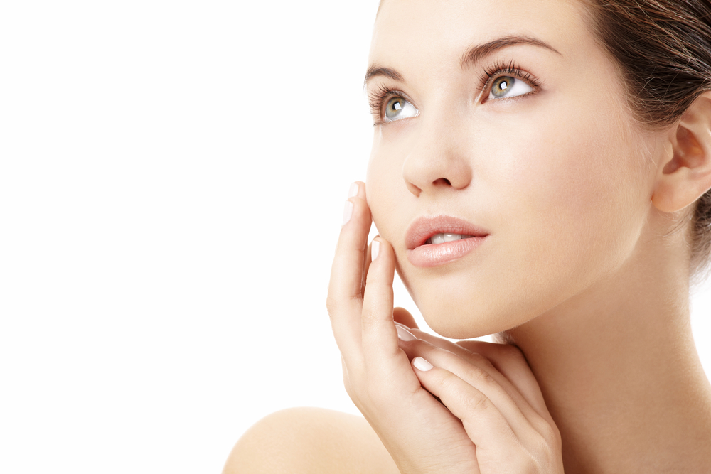 Woman with smooth skin, illustrating microneedling results.